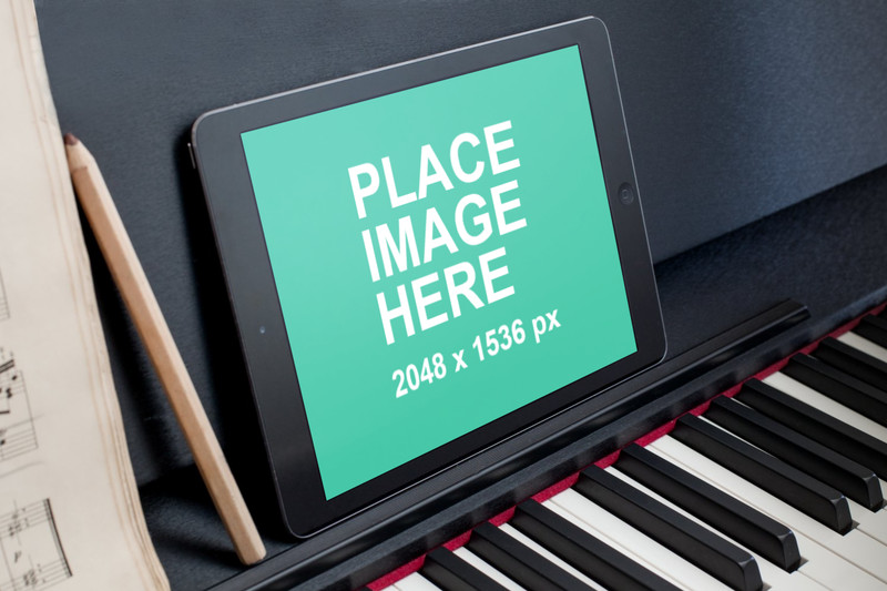 Black iPad Air on piano
