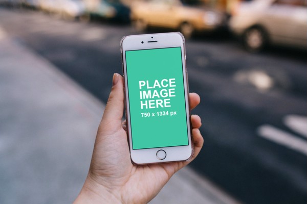 Woman holding iPhone mockup