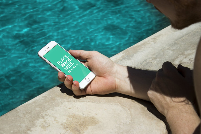 White iPhone 6 at poolside